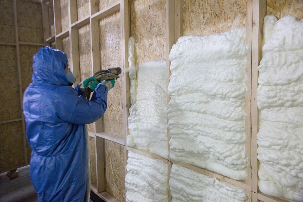 Foam is applied to the walls to warm the house